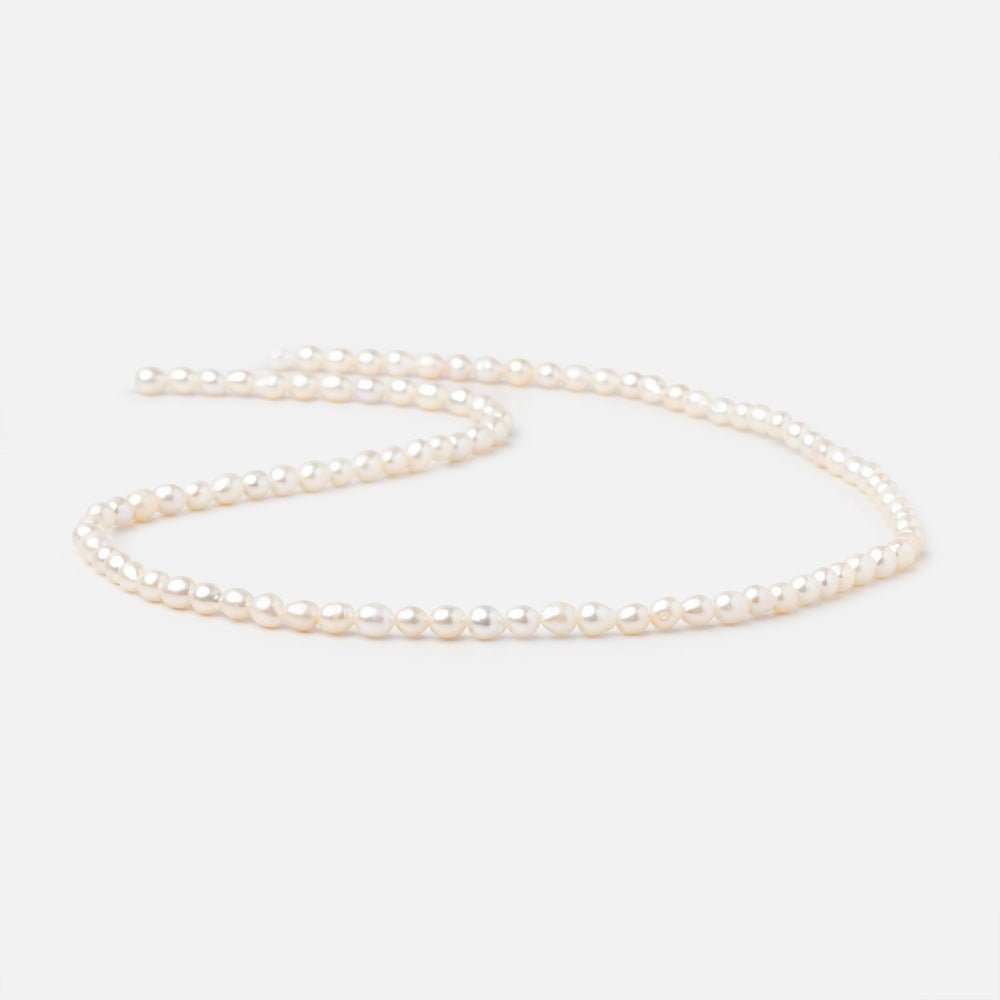 4-4.5mm Creamy White Straight Drill Oval Freshwater Pearls 15.25 inch 98 Beads - Beadsofcambay.com