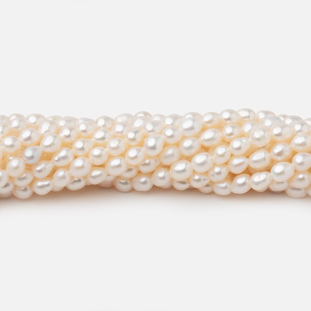 4-4.5mm Creamy White Straight Drill Oval Freshwater Pearls 15.25 inch 98 Beads - Beadsofcambay.com