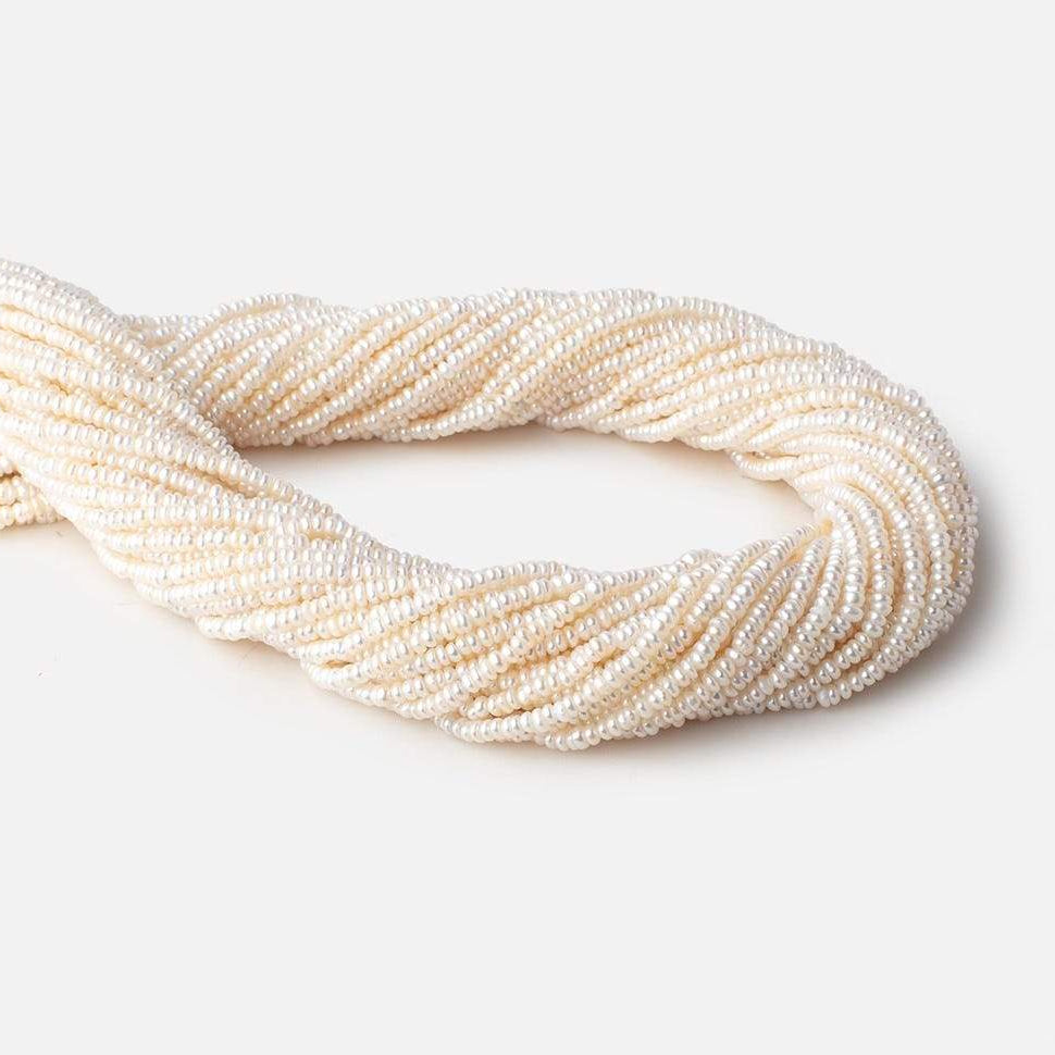 2.5mm Off White Center Drilled Button Freshwater Pearls 15.5 inch 305 pieces - Beadsofcambay.com