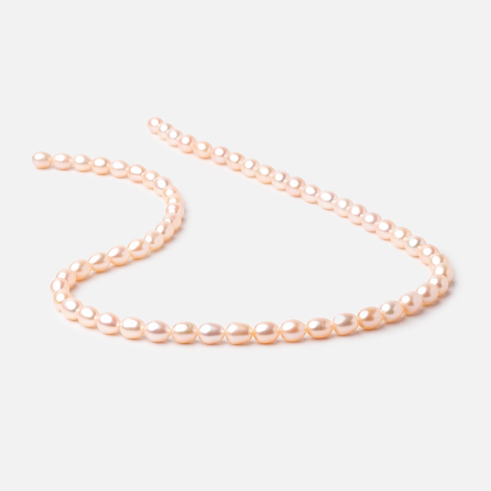 7x5mm Peach Straight Drill Oval Freshwater Pearl 15 inch 56 pcs - BeadsofCambay.com