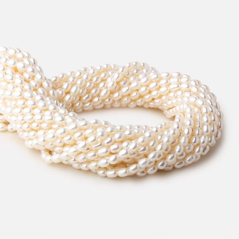 4x5-4.5x6mm Off White straight drilled Oval freshwater pearls 15.5 inch 68 pieces A - Beadsofcambay.com