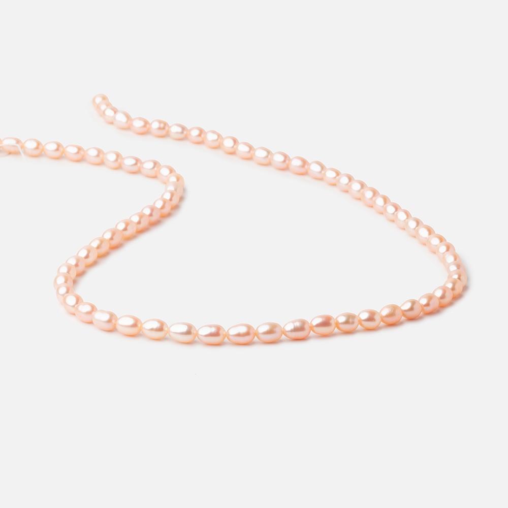 5.5x4mm Peach Straight Drill Oval Freshwater Pearl beads 15 inch 66 pieces - Beadsofcambay.com