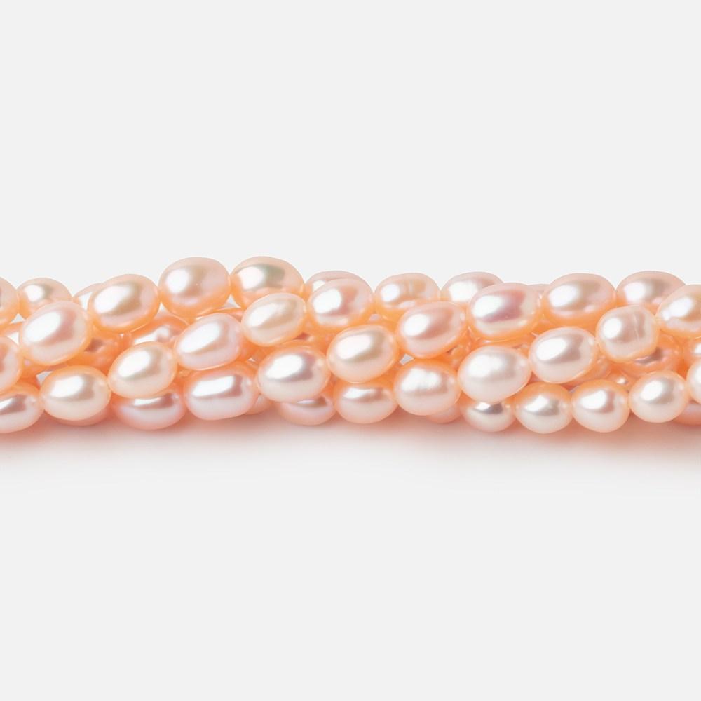 5.5x4mm Peach Straight Drill Oval Freshwater Pearl beads 15 inch 66 pieces - Beadsofcambay.com