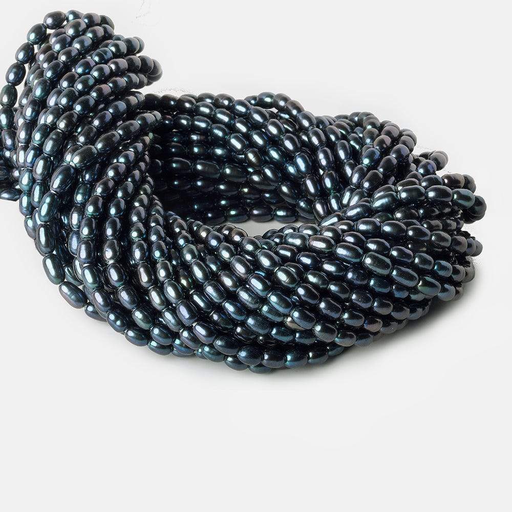 7x5-8x5mm Indigo Blue Large Hole Oval Freshwater Pearls 1.5mm drill hole 15 inch 48 pcs - Beadsofcambay.com