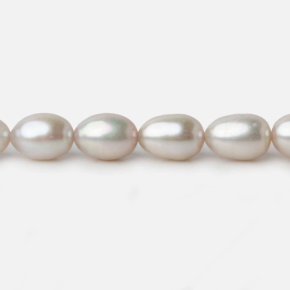 7x9-7x10mm Silver Champagne Straight Drill Oval Freshwater Pearl 16 inch 40 pieces A - Beadsofcambay.com