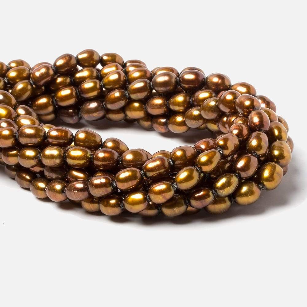 8x5mm Golden straight drilled oval pearls 16 inch 55 pieces - Beadsofcambay.com