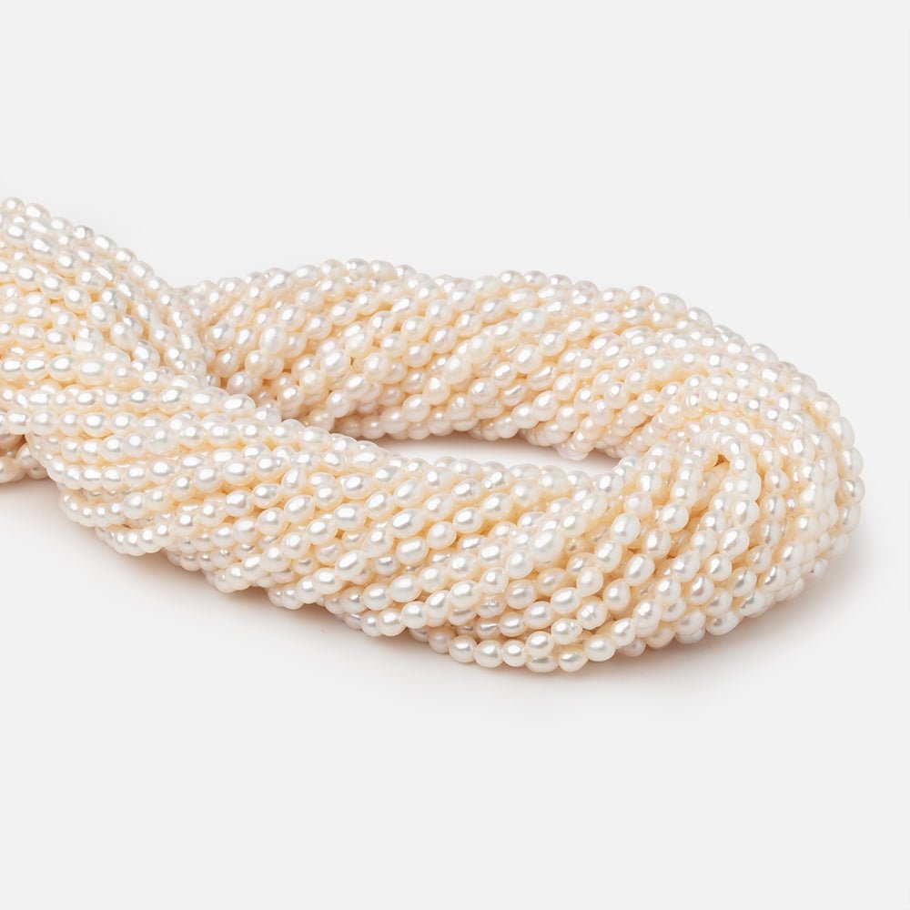 4-4.5mm Creamy White Straight Drill Oval Freshwater Pearls 15.25 inch 98 Beads - Beadsofcambay.com