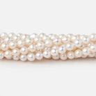 5 - 5.5mm Creamy White Petite Baroque Freshwater Pearls 15 inch 70 Beads - Beadsofcambay.com