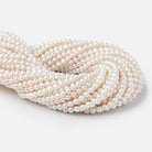 5 - 5.5mm Creamy White Petite Baroque Freshwater Pearls 15 inch 70 Beads - Beadsofcambay.com