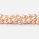 5 - 5.5mm Peach Petite Oval Freshwater Pearls 15.75 inch 75 Beads - Beadsofcambay.com