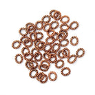 6x5mm Antiqued Copper Twisted Oval Shaped Jump Ring Set of 50 - Beadsofcambay.com