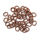 8x6.5mm Antiqued Copper Twisted Oval Shaped Jump Ring Set of 50 - Beadsofcambay.com