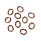 8x6.5mm Antiqued Copper Twisted Oval Shaped Jump Ring Set of 50 - Beadsofcambay.com