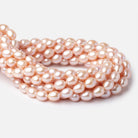 9 - 11mm Petal Pink Oval Freshwater Pearls 16 inch 36 Beads - Beadsofcambay.com