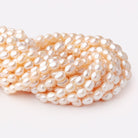 9.5 - 10.5mm Peach Baroque Freshwater Pearls 15.5 inch 35 Beads - Beadsofcambay.com