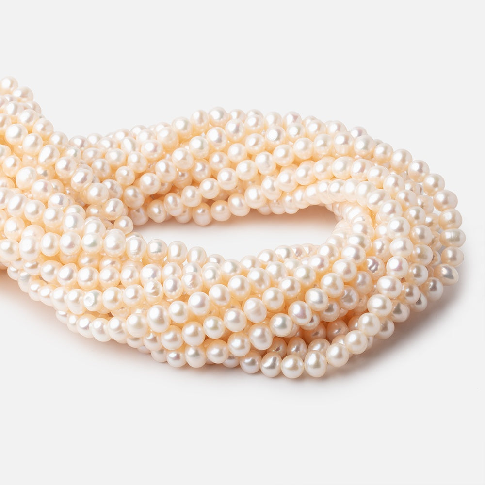 6x5-7x6mm Cream Rose' Off Round Freshwater Pearls 16 inch 71 pcs - BeadsofCambay.com