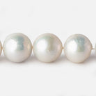 11.5x12-14.5x15mm White Near Round Freshwater Pearl 17 inch 34 pieces A - Beadsofcambay.com