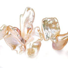 12x10-16x13mm Iridescent Peach Keshi Top Drilled Freshwater Pearls 15 inch 42 pieces AAA - Beadsofcambay.com