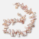 13x6-22x6mm Pinkish Lilac Top Drilled Biwa Freshwater Pearls 15 inch 70 pcs AA - Beadsofcambay.com