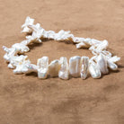 13x9-20x9mm White Biwa Freshwater Pearls 14.5 inch 50 pieces - Beadsofcambay.com
