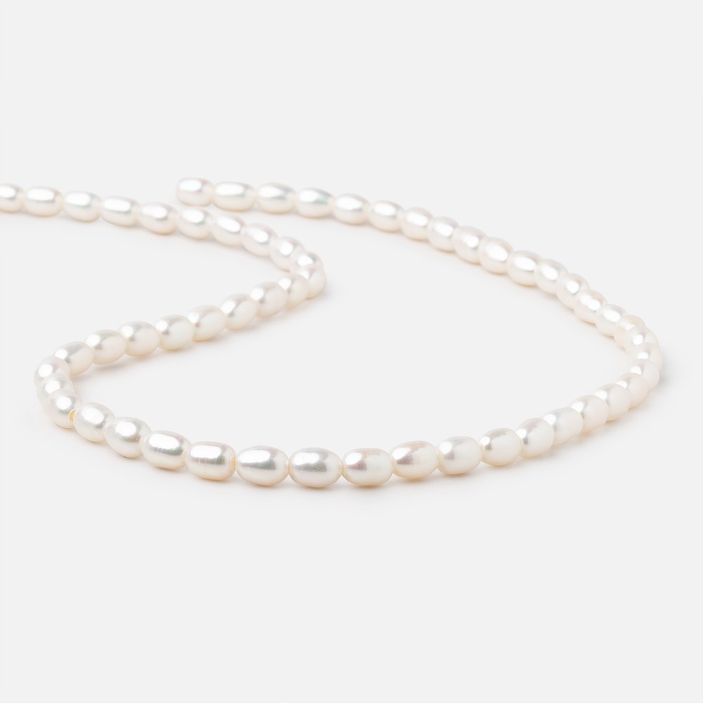 7x5-8x5mm Off White Large Hole Oval Freshwater Pearls 1.5mm drill hole 15 inch 52 pcs - BeadsofCambay.com