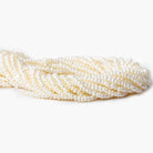 2.5-3mm Off White Center Drilled Button Freshwater Pearl 250 pieces - Beadsofcambay.com