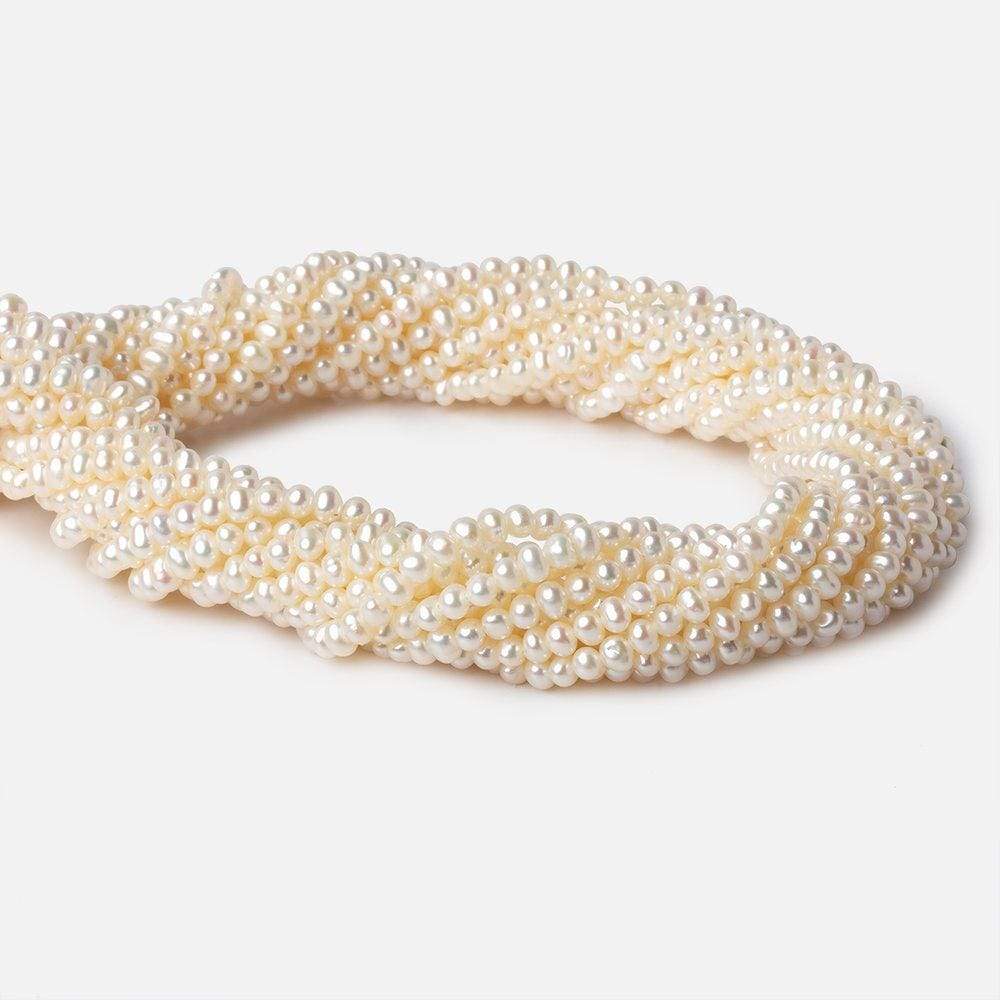 3.5x2.5mm Cream Off Round Freshwater Pearls 140 pcs - Beadsofcambay.com