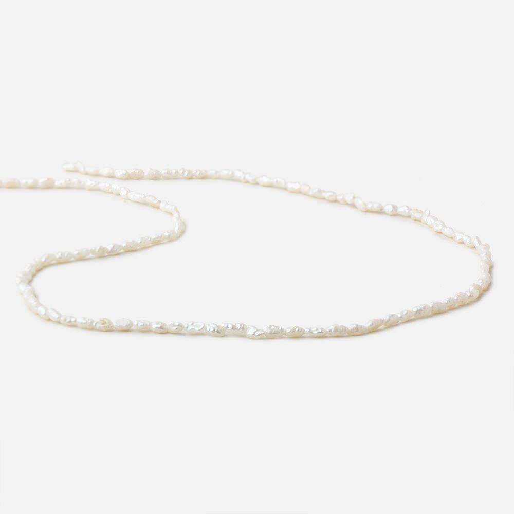 3x2.5-5x2.5mm Off White straight drilled Baroque Rice Freshwater Pearls 16 inch 95 pieces - Beadsofcambay.com