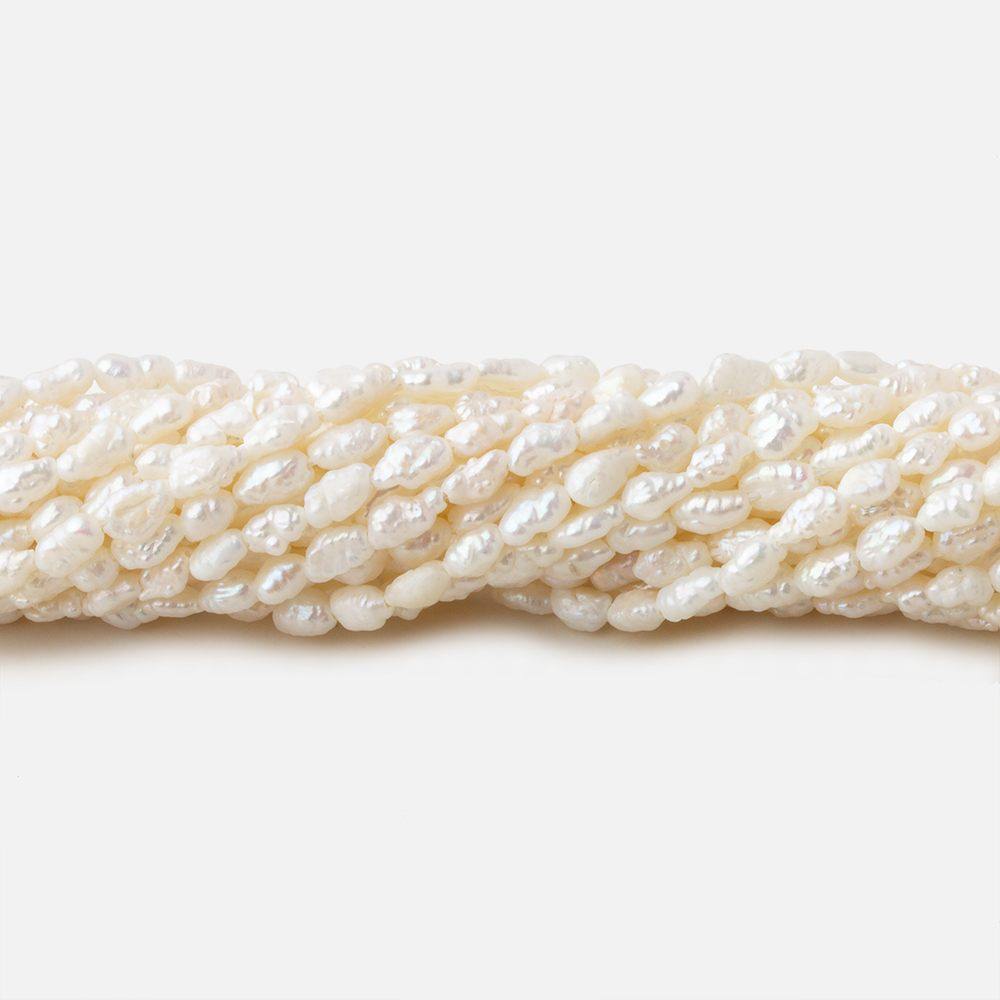 3x2.5-5x2.5mm Off White straight drilled Baroque Rice Freshwater Pearls 16 inch 95 pieces - Beadsofcambay.com