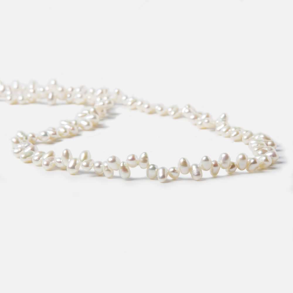 4.5x3-5x3mm White Top Drilled Oval Freshwater Pearls 16 inch 141 pieces - Beadsofcambay.com