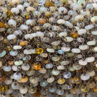 4mm Ethiopian Opal plain rondelle Black over .925 Silver Chain by the foot 45 beads - Beadsofcambay.com