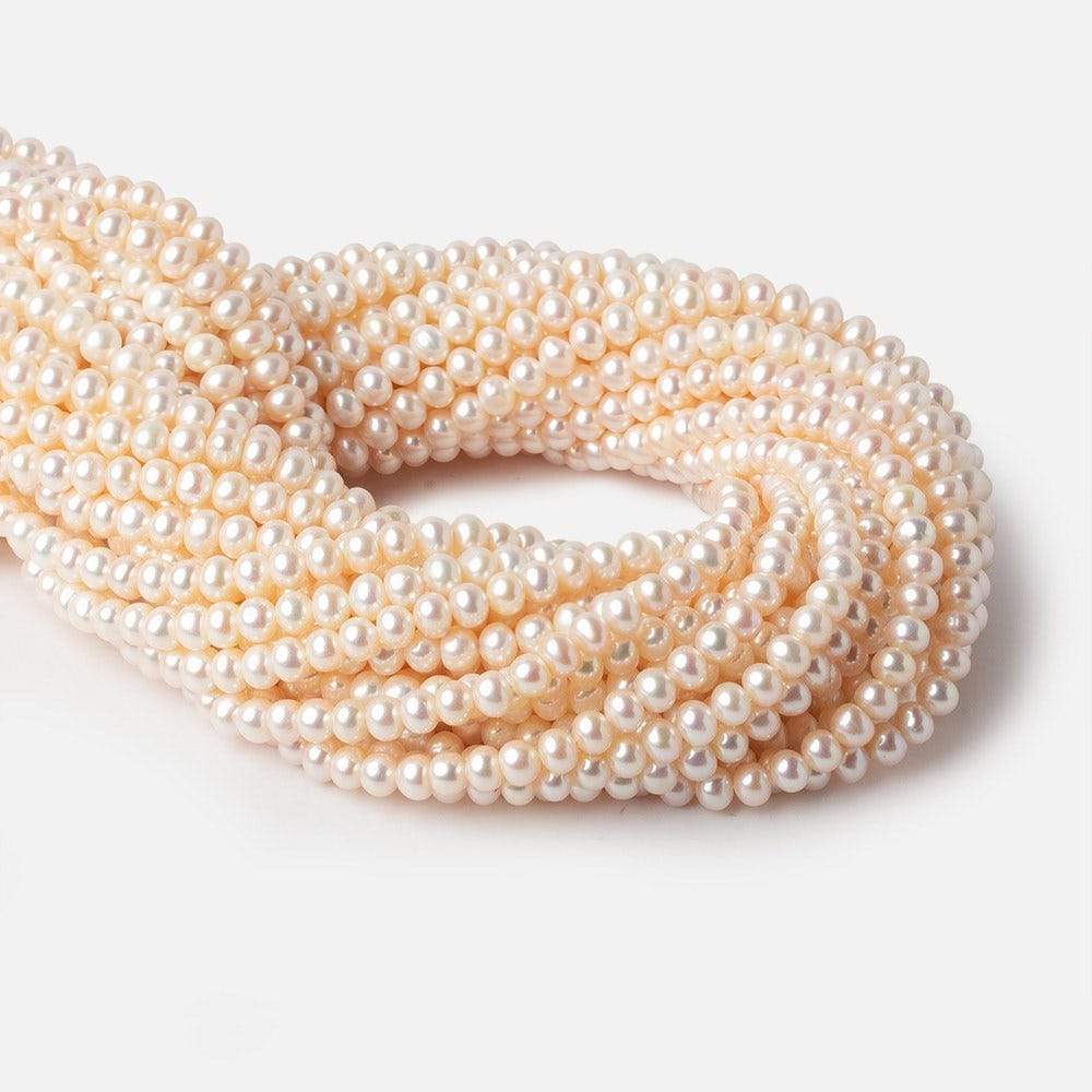 5.5x4mm Cream Side Drilled Off Round Freshwater Pearls 15 inch 85 pieces - Beadsofcambay.com