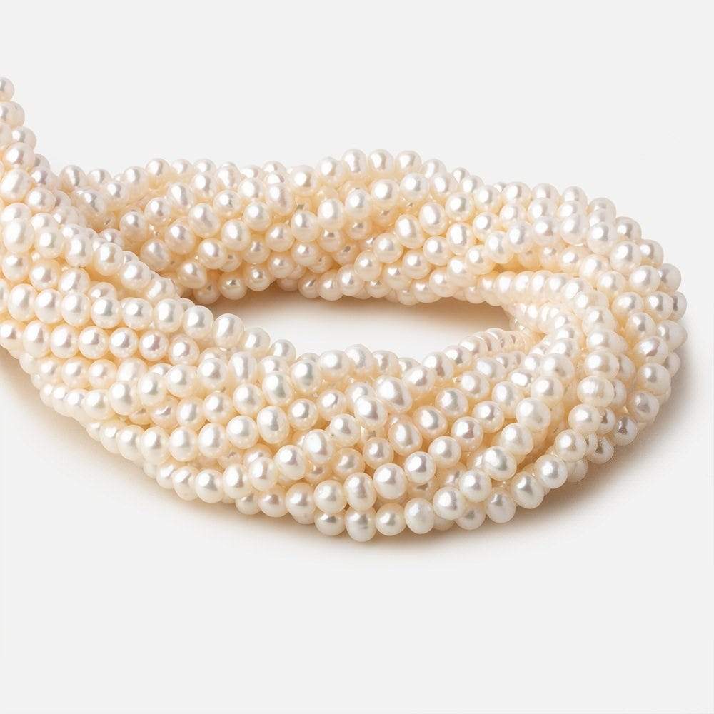 5.5x5-6x4.5mm Off White side drilled Oval freshwater pearls 15 inch 78 pieces A - Beadsofcambay.com