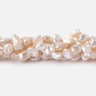 6-7mm Light Peach Side Drilled Keshi Freshwater Pearls 15.5 inch 70 pieces - Beadsofcambay.com