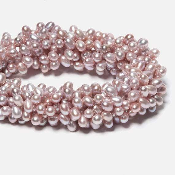 6x5-7x5mm Ice Pink Top Drilled Oval Freshwater Pearls 16 inch 96 pieces - Beadsofcambay.com