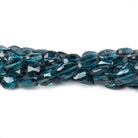 6x5-7x5mm London Blue Topaz Faceted Oval Beads AA Grade 8 inch 30 beads - Beadsofcambay.com