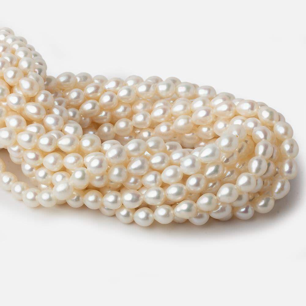 6x7mm Cream Straight Drill Oval Freshwater Pearls 15 inch 52 pieces A - Beadsofcambay.com