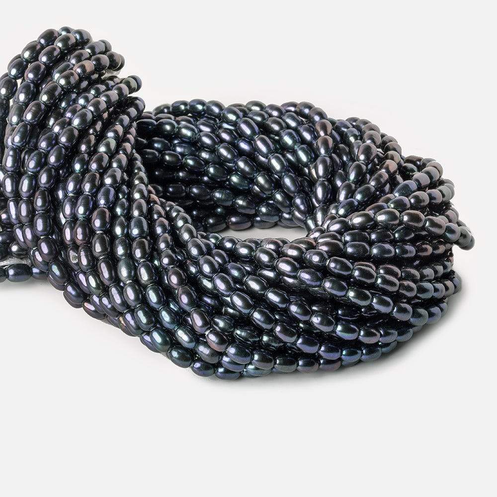 7x5-8x5mm Indigo Blue Large Hole Oval Freshwater Pearls 1.5mm drill hole 15 inch 48 pcs - Beadsofcambay.com