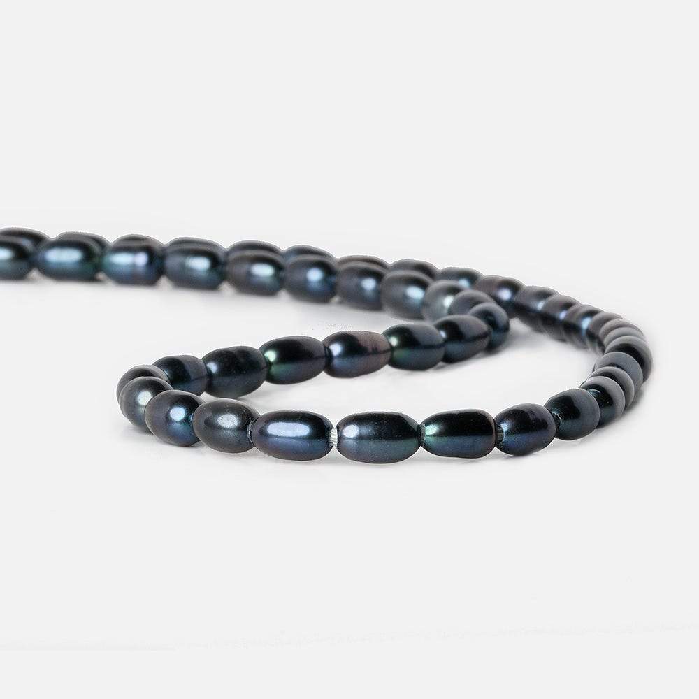 7x5-8x5mm Indigo Blue Large Hole Oval Freshwater Pearls 1.5mm drill hole 15 inch 48 pcs - Beadsofcambay.com