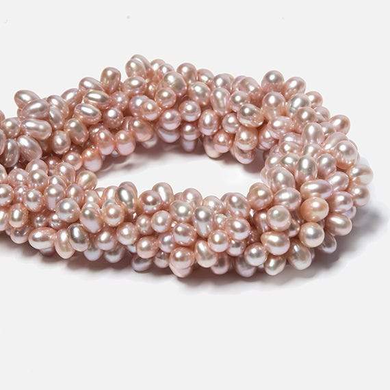 7x5-8x6mm Peachy Pink Top Drilled Oval Freshwater Pearls 16 inch 74 pieces - Beadsofcambay.com