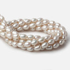 7x9-7x10mm Silver Champagne Straight Drill Oval Freshwater Pearl 16 inch 40 pieces A - Beadsofcambay.com