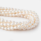 7x9-8x10mm Cream Straight Drilled Oval Freshwater Pearls 15 inch 40 pieces - Beadsofcambay.com