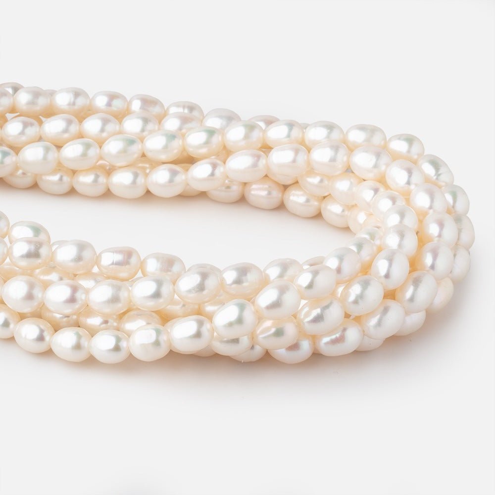 7x9-8x10mm Cream Straight Drilled Oval Freshwater Pearls 15 inch 40 pieces - Beadsofcambay.com