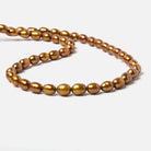 8x5mm Golden straight drilled oval pearls 16 inch 55 pieces - Beadsofcambay.com